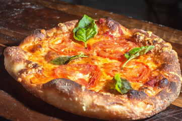 Homemade Italian pizza with natural fermentation, various flavors among them pastrami, bacon and pulled pork,pizza concept