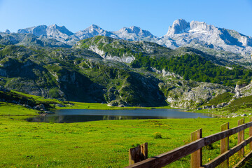 Picturesque rocky landscape with mountain range above lake of Covadonga in summer day, Spain ..