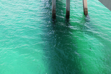 Underneath boardwalk - ocean under a pier