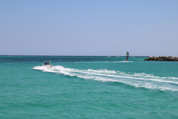 speed boat in the ocean moving left