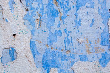Old painted wall with cracked paint
