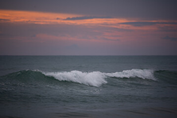 soft wave on beach with sunset time