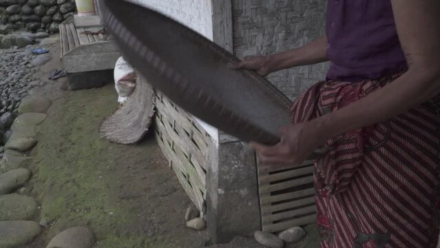 Kampung Naga, Indonesia - Wild Rice Processing Winnowing by Old Indonesian Woman