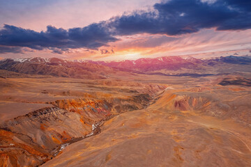 Landscape mountains Altai Republic Russia, texture of red sand in Mars valley, aerial top view with sunset