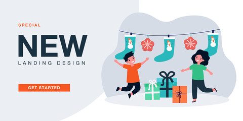 Cute kids with funny Christmas stockings hanging on rope. Boy and girl receiving xmas gift boxes flat vector illustration. Holiday, present concept for banner, website design or landing web page