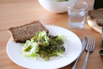 Salad of fresh green vegetables and fruits
