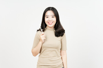 Holding toothbrush and smiling to camera Of Beautiful Asian Woman Isolated On White Background