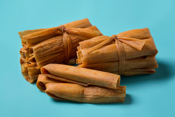 Isolated Tamales in Corn Husks