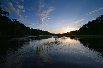 Sunset over Fisheating Creek near Palmdale, Florida on calm summer afternoon.