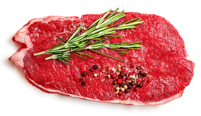 Fresh beef steak isolated on white background, top view. Raw meat fillet with spices and rosemary herbs.