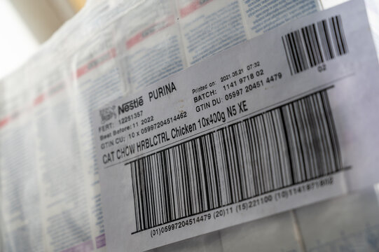Close-up of a barcode tag on a stock package of cat food. Pallet Purina Cat Chow wrapped in plastic wrap. Ukraine, Mykolayiv -05 25 2022
