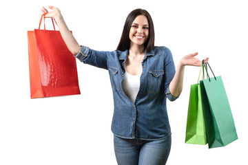 Happy woman with colorful shopping bags on white isolated background. Pretty smiling girl in studio. Sale