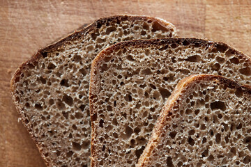 The process of baking rye bread. Sliced ready-made homemade bread. The concept of healthy eating. Front view.