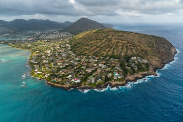 Residential houses on the cliff by Hanauma Bay and Koko Crater summit in background , Oahu Island,...