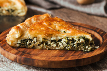Closeup on slice of freshly baked spinach and cheese pie