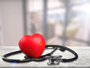 Red heart love shape with doctor physician's stethoscope. Hospital life insurance concept