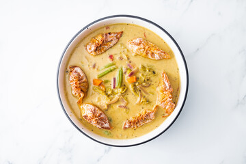 healthy plant-based food, vegetable green curry with vegan wonton dumpling