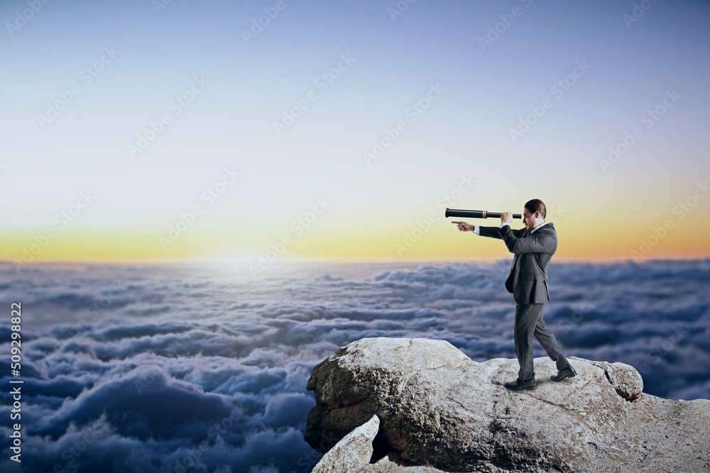 Aufkleber man with telescope standing on cliff, looking and pointing finger into the distance on bright blue sky and clouds background with mock up place for your advertisement. 