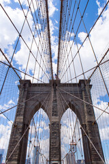 The Brooklyn bridge and the American flag, New York City. USA.