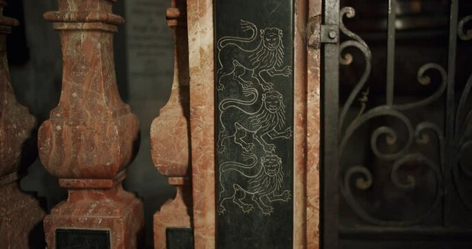 Close up shot of a small lion decoration in a chapel of a big church in Italy. The name of the Church is Basilica di Desio.