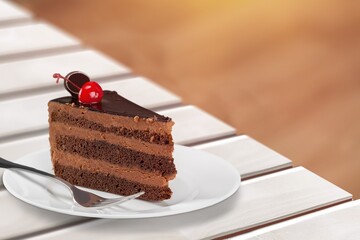 A piece of sponge cake decorated on a plate