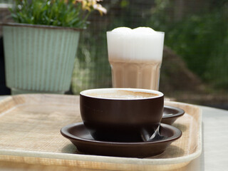 Coffee, cappuccino on a table in a cafe.