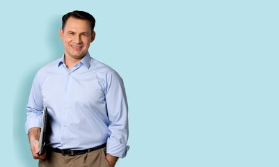 Young man hold working on laptop pc computer on background.