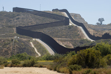 A double border wall between the U.S. and Mexico, separating San Diego and Tijuana, is seen from...