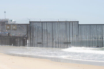 The border fence between the U.S. and Mexico seen from the beach in Border Field State Park. It separates San Diego from Tijuana and extends into the Pacific Ocean.