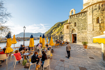 Town square in Vernazza village on the northwestern coast of Italy. Famous village at Cinque Terre National Park - obrazy, fototapety, plakaty