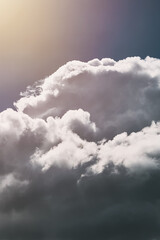 Blue sky with clouds on a sunny day. Abstract natural background. Concept of freedom and carefreeness