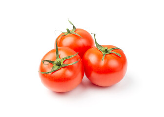 Three red tomatoes isolated on a white background. 
Fresh tomatoes.