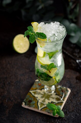 Mojito cocktail with mint leaves and lemon slices. Tropical rum-based cocktail