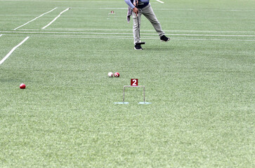 Athlete play gateball game in a field lawn to beat competitors