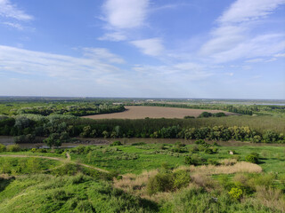 Summer valley with river, forest, hills and beautiful sky with clouds