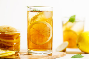 glass of ice lemon tea with mint.