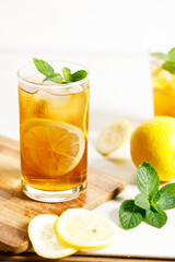 glass of ice lemon tea with mint.