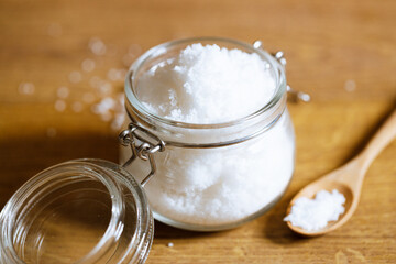 salt on wooden background.