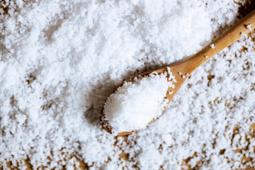 salt on wooden background.