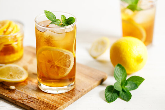 glass of ice lemon tea with mint.