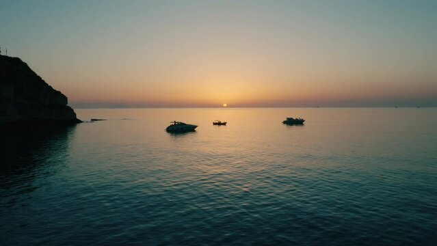 Silhouette of the promontory of Tropea at sunset in Summer