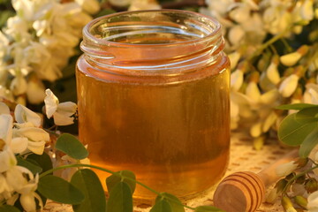 jar of honey with acacia flowers