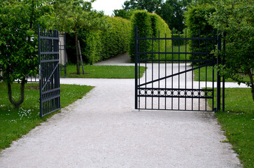 gate and fence at the castle in the autumn sun. the lattice ending the end of the wall protected...