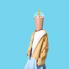 Woman with cup of tasty bubble tea instead of her head on light blue background