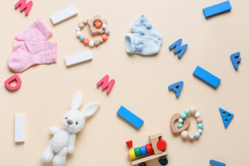 Educational toys with socks on beige background