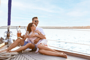 Fototapeta Happy young couple resting on yacht obraz