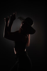 Obraz premium Posing with her hands, silhouette