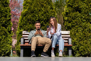 Fototapeta premium Cheerful couple relaxing in the park