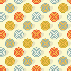 Seamless background pattern with parasols in the sand