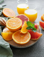 Naklejka na ściany i meble Glasses of juice and citrus fruits